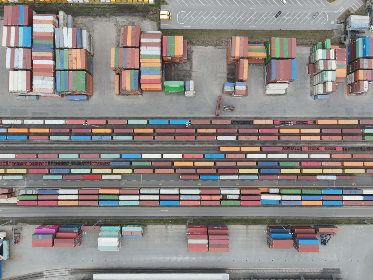 services-02 Aerial shot of stacked cargo containers at Regensburg port showcasing freight transport activity.
